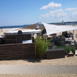 Starkwind-Sonnensegel Sunfurl-RM Ostseelounge Travemünde Ostseelounge Travemünde: Starkwind-Sonnensegel Sunfurl-RM